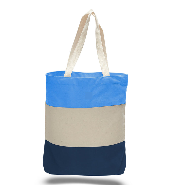 Tote bag with a light blue, beige, navy blue horizontal tri-tone colour block design on a white background