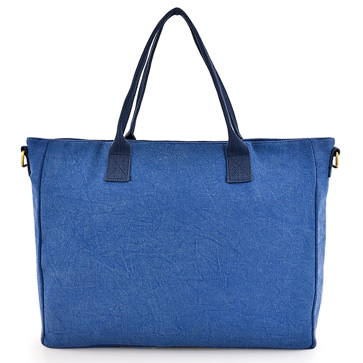 Blue tote bag with black handles on a white background