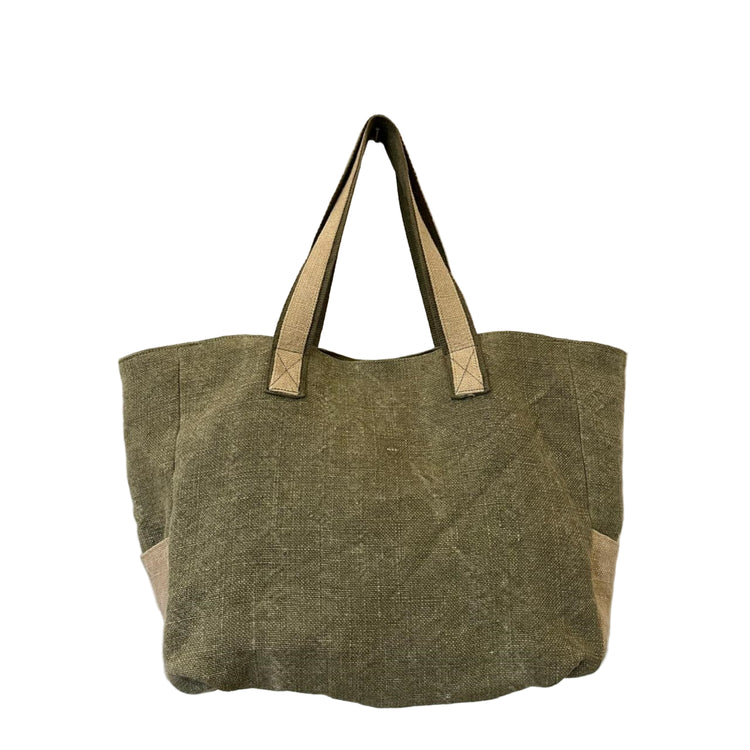 Green tote bag with beige handles on a textured white background