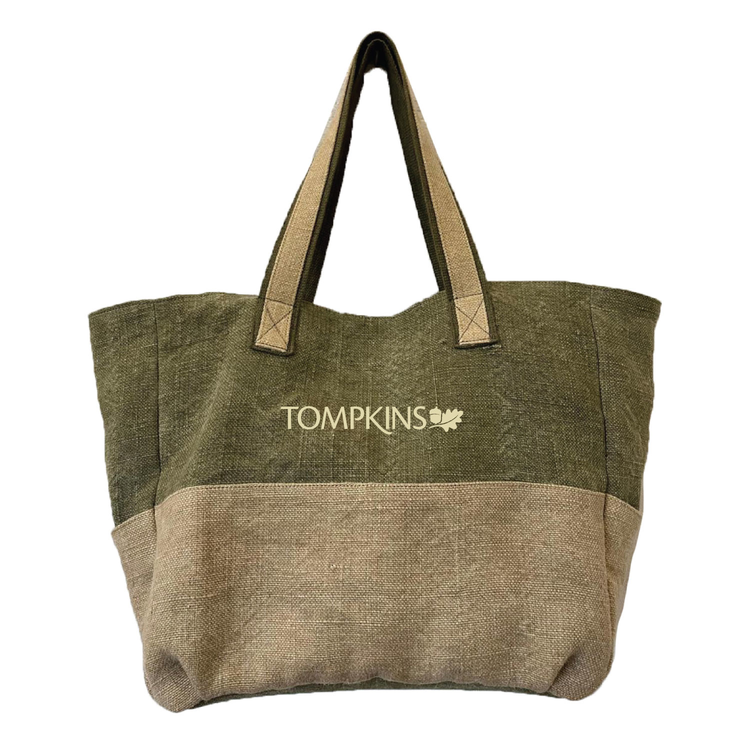 Green and brown tote bag with 'Tompkins' logo on a white background
