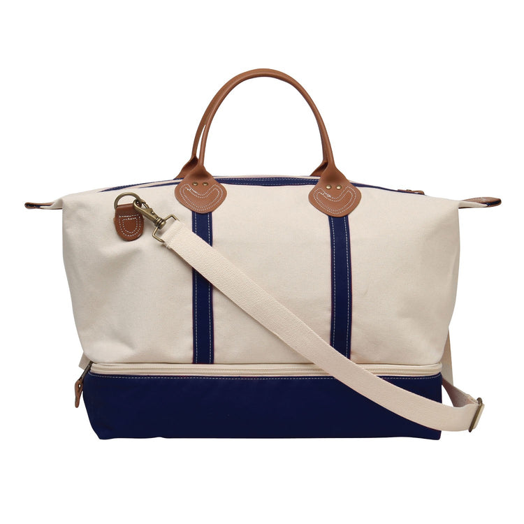 Canvas bag with navy stripes and brown handles on a white background