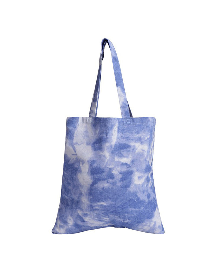 Tie-dye tote bag with blue and white pattern on a white background