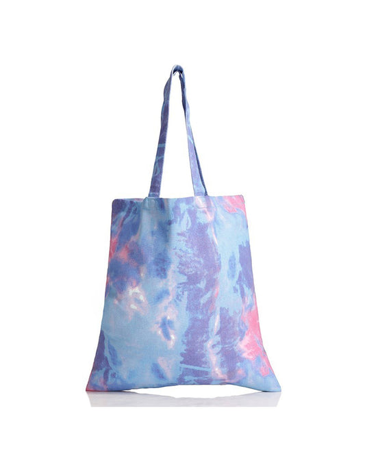 Tie-dye tote bag with blue and pink patterns on a white background