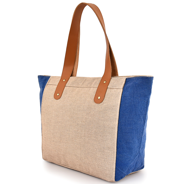 Tote bag with beige body and blue side panels on a white background