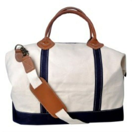 White and navy bag with brown leather straps on a white background