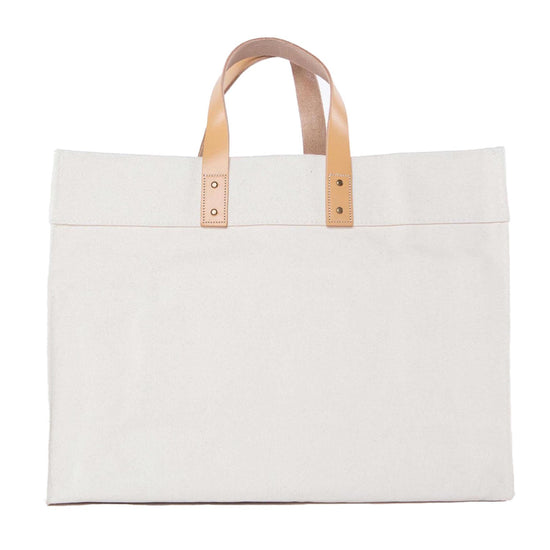 White tote bag with beige handles on a white background