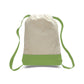 Canvas drawstring bag with green base and straps on a white background