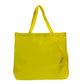 Yellow tote bag with a visible stain on a white background